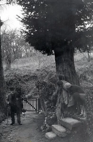 Children hiding from elderly gentleman at Upperton, Sussex December 1935