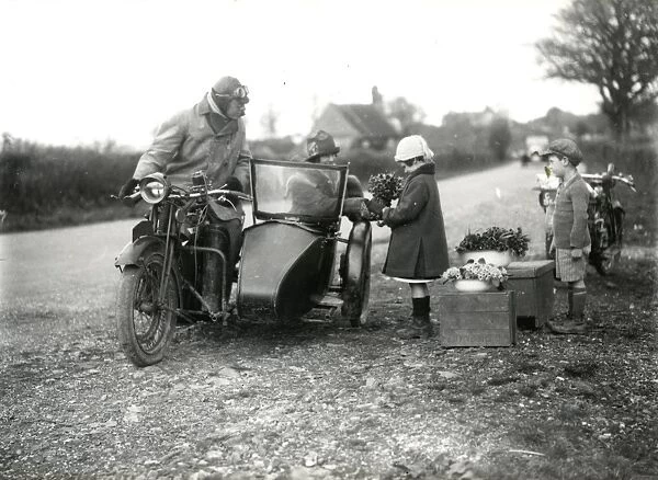 Children selling wild flowers to motorists, April 1927