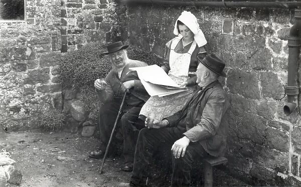 Two country gentlemen and young lady discussing a newspaper in 1930s