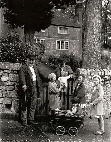 Two elderly locals chatting to a group of children over the garden gate