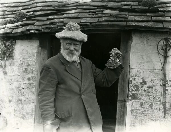 Elderly man with beard posing in doorway, March 1938