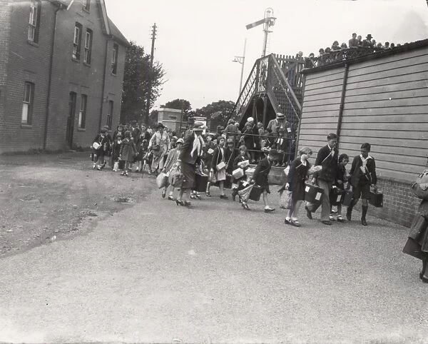 Evacuees approaching railway station, September 1939