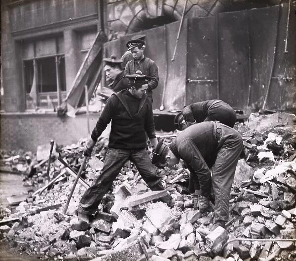 Free French sailors helping with clear up after air raid, Portsmouth, 1941
