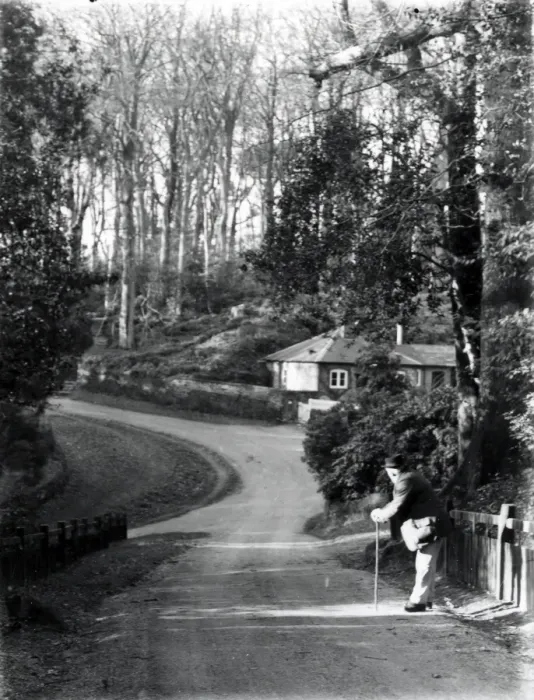 Framed Print : Gentleman leaning on stick in country lane, January 1935 Framed Print : Gentleman leaning on stick in country lane, January 1935