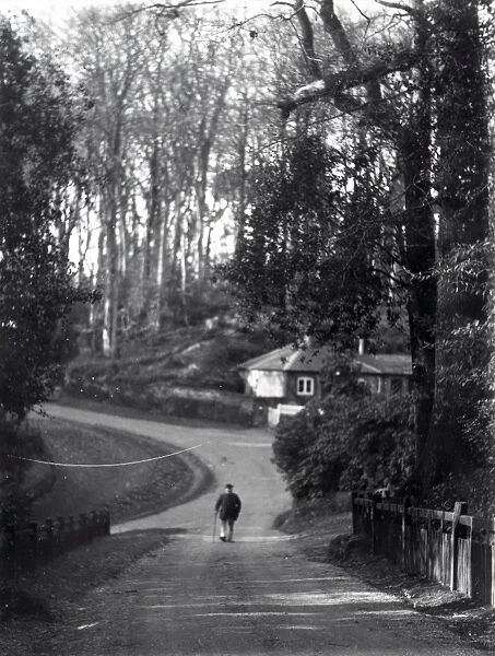 Gentleman walking down a country road at Dean, Sussex, 1935
