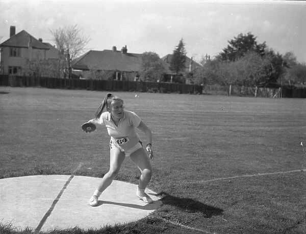 Girl throwing discus, 1 May 1963