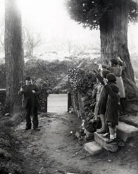 Four girls waving to elderly gentleman at Upperton, Sussex. December 1935