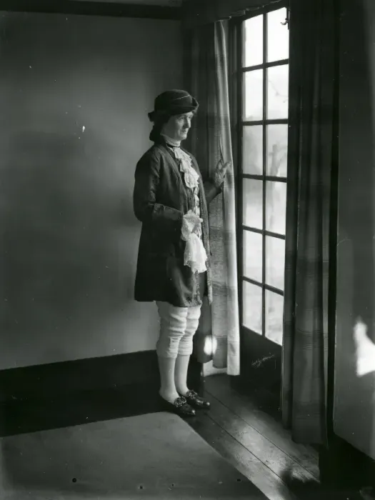 Framed Print : Lady in fancy dress gazing out of a window, February 1938 Framed Print : Lady in fancy dress gazing out of a window, February 1938