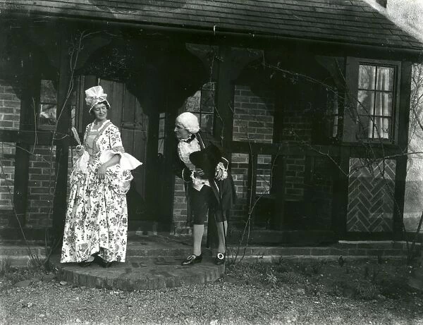 Lady and gentleman posing in fancy dress, February 1938