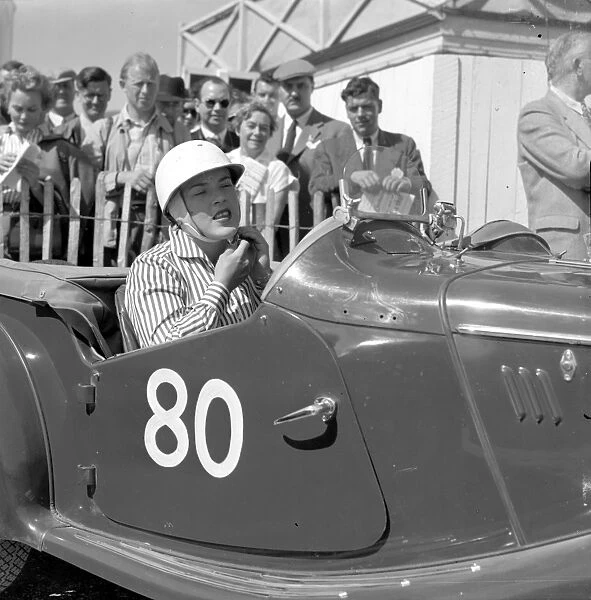 Lady racing driver preparing for a race at Goodwood, 28 May 1955