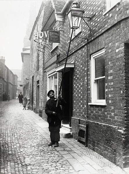 Lamplighter in Lombard St., Petworth, 1931