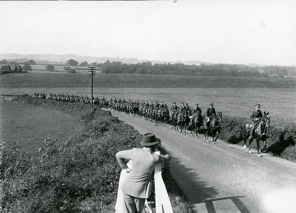 Life Guards riding up Duncton Hill, being watched by a farmer, August 1936