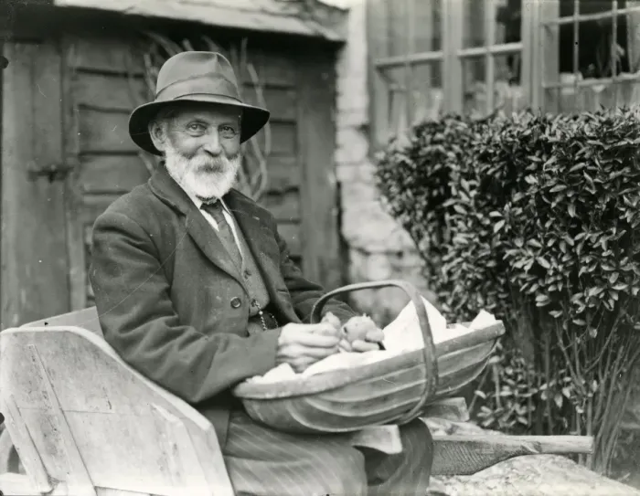 Framed Print : Man sitting outside house Framed Print : Man sitting outside house