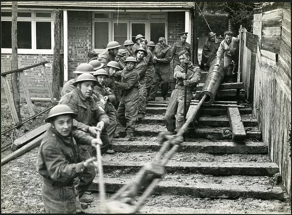 Men of The Royal Artillery moving barrel of gun, Bognor Regis 1940