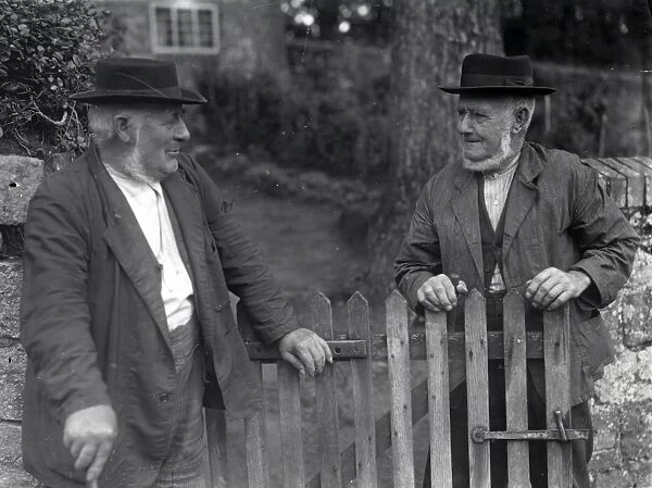 Two men talking over a gate at Upperton, Sussex, 1935