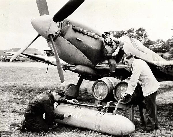 A modified auxiliary fuel tank being filled with beer, Bognor Regis, 1944