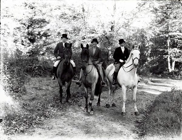 Three people riding horses in the country, November 1936