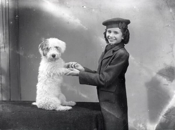 Portrait of a young woman with her dog - 27 November 1943