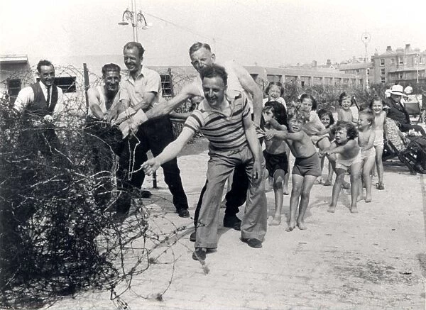 Removal of barbed wire from the Esplanade, Bognor, 1945