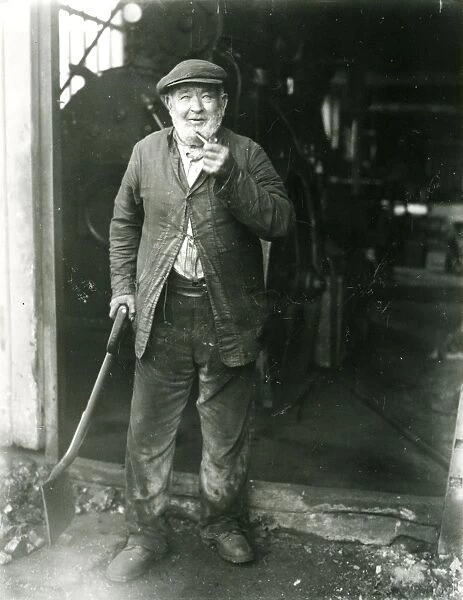 Stoker at a saw mill, West Grinstead, October 1933
