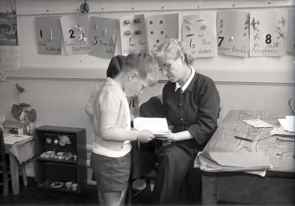 Teacher and two children, Lancastrian Infants School, Chichester, May 1956