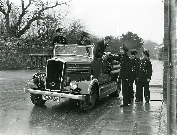 Wedding couple getting out of fire brigade vehicle, January 1945