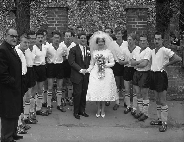Wedding group with football players, November 1962