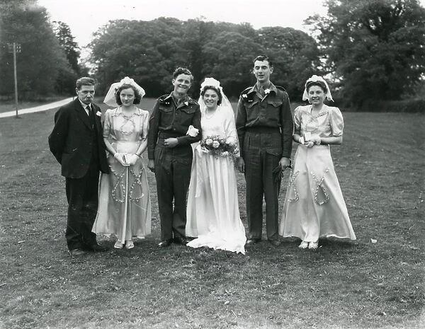 Wedding party at Ebernoe, Sussex. Groom and Best Man in army uniform, 1940s