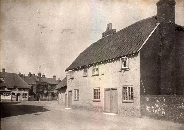 Westbourne, 1910. Corner of village street with houses and shop