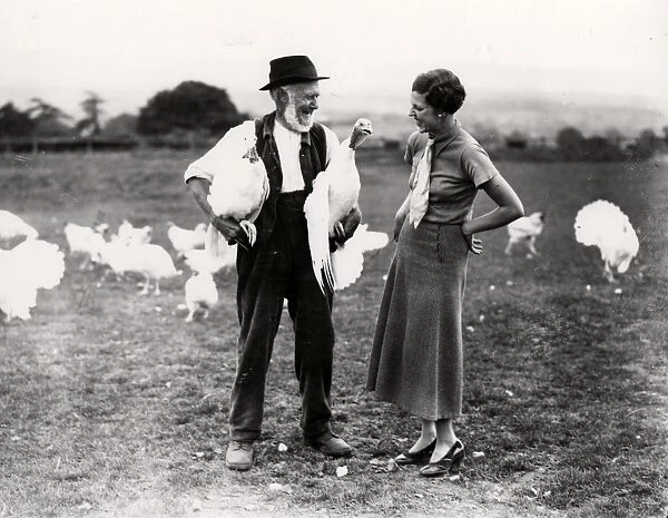 White turkeys with farmer and lady 1934. George Garland Collection