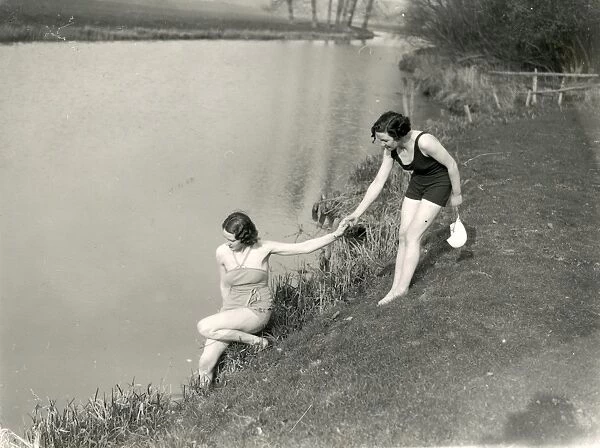 Two young ladies attempting to swim in river at Stopham, March 1938