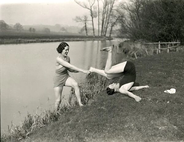 Young ladies doing gymnastics on riverbank at Stopham, March 1938