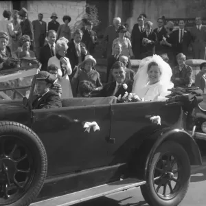 Bride and Groom in open top motor car Bride and Groom in open top motor car