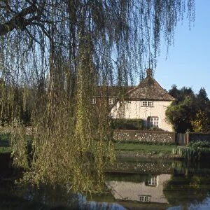 Cottages and pond in the village of East Dean, West Sussex