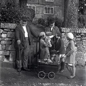 Two elderly gentlemen and four young girls chatting in Upperton, Sussex, 1935