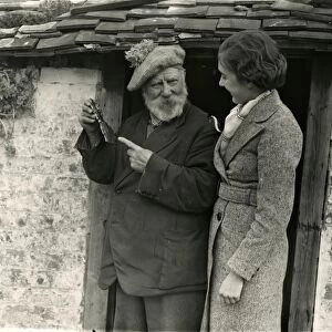 Elderly man and younger lady in conversation, March 1938