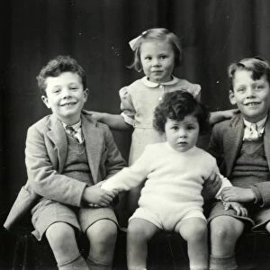 Family portrait of four children - 5 December 1945