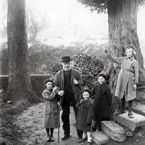 Group of people in holly woods at Upperton, Sussex, December 1935