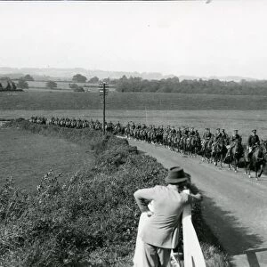 Life Guards riding up Duncton Hill, being watched by a farmer, August 1936