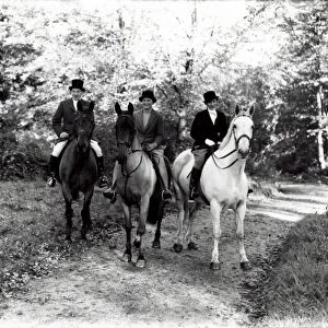 Three people riding horses in the country, November 1936