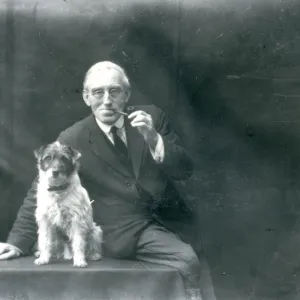 Portrait of elderly gentleman with his dog, December 1928