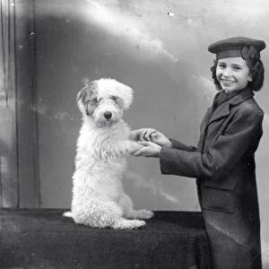 Portrait of a young woman with her dog - 27 November 1943