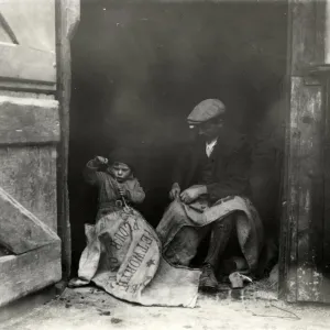 Sack mending, a slack time job on the farm, 1933