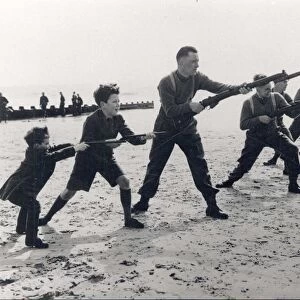 Soldiers training with rifles and bayonets on the beach [1940]