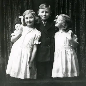 Studio portrait of three children, December 1935