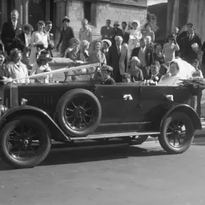 Wedding Day with Bride and Groom seated in open top motor car, 1960s Wedding Day with Bride and Groom seated in open top motor car, 1960s