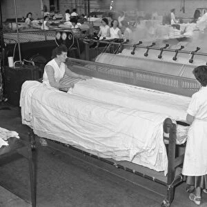 Women making bed linen in a factory, 1960s