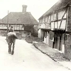 Young boy riding shire horse at Byworth, Sussex, c1931