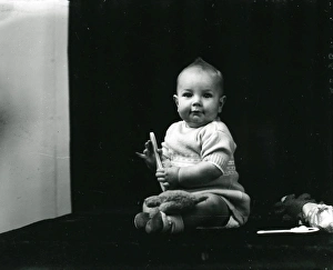 Cheeky Prints: 1940s portrait of a baby posing with toys