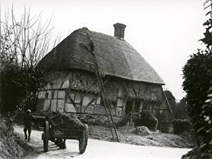 Images Dated 22nd August 2014: Bignor General Shop with thatcher and horse and cart, February 1938
